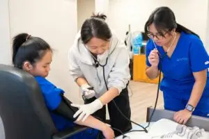 Group of nursing students working together in a clinical training environment